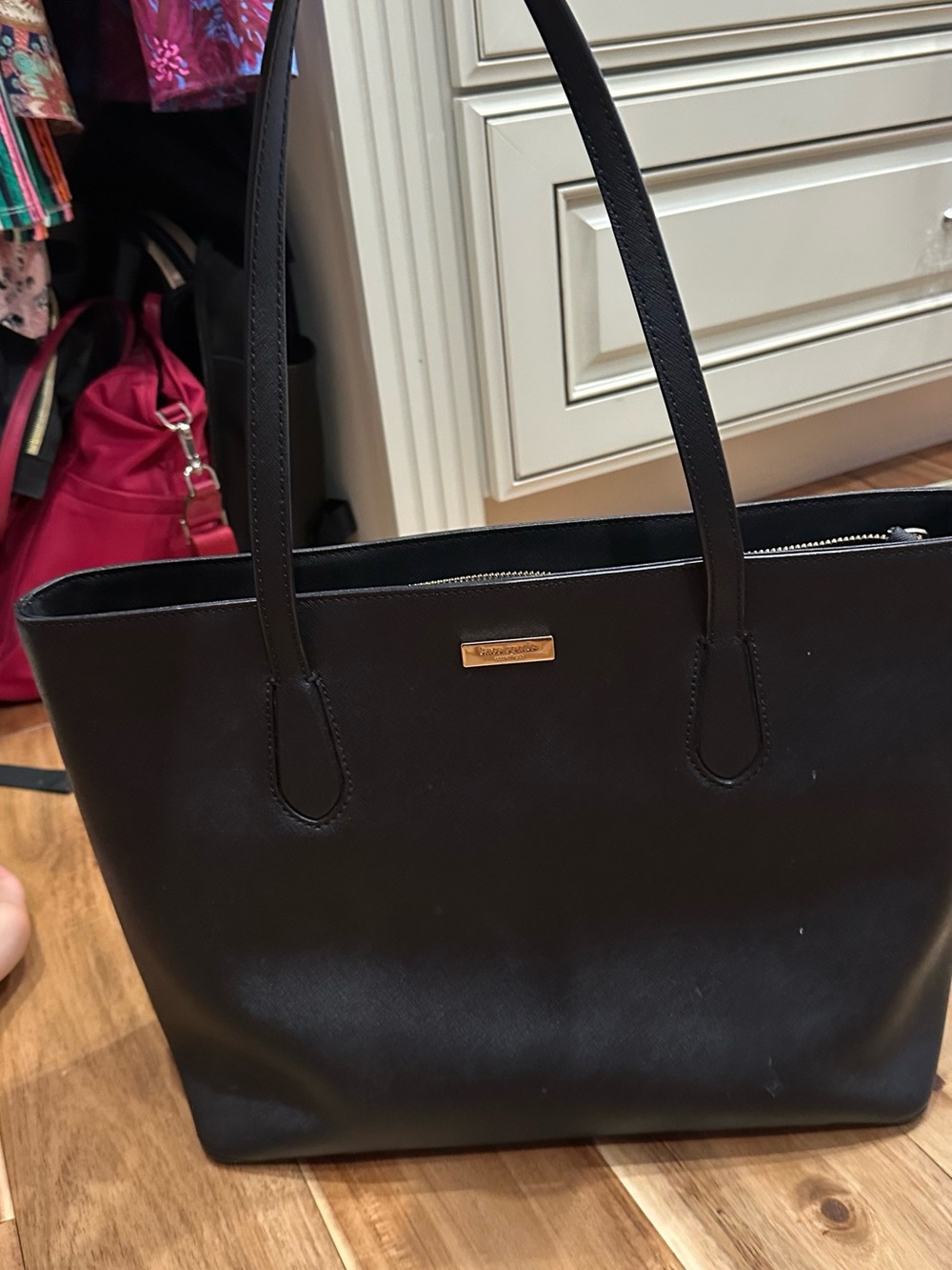 kate spade black leather tote with gold logo plate